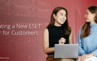 Two women discussing ESET user setup with a laptop, representing creating a new ESET user for customers.