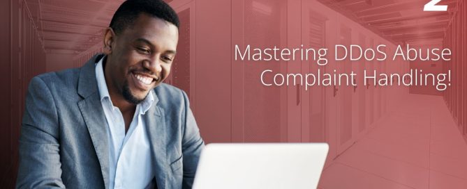 DDoS abuse complaint handling banner with a professional smiling at a laptop