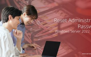 Reset Administrator Password Windows Server 2022 Guide – Two IT professionals working on a laptop with a server rack background.