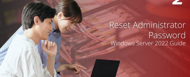 Reset Administrator Password Windows Server 2022 Guide – Two IT professionals working on a laptop with a server rack background.